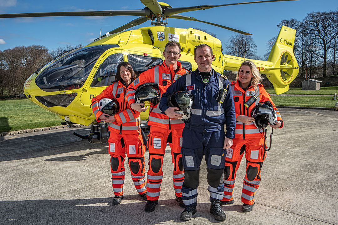 Pilots outside of helicopter