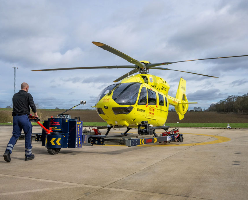 Fundraiser in front of helicopter